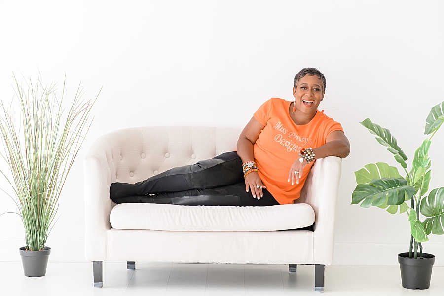 woman on white couch with plants, branding photos, Brand Photography
